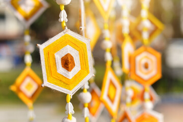 Hanging handmade hexagonal colorful knitting yarn flags. Colorful drape, Blown in the traditional...