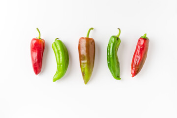 Overhead shot of fresh red and green pepper on white background
