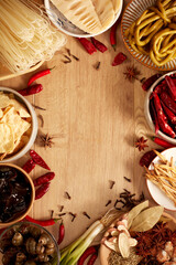 Delicious Chinese food, ingredients for making snail rice noodles. On wood table