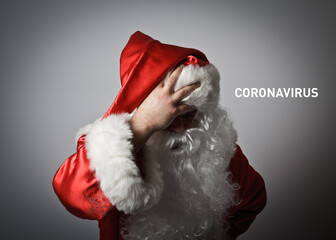 Frustrated Santa Claus, he is full of doubts and hesitation. Concept about coronavirus outbreak. Text about Coronavirus.