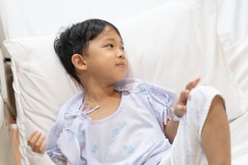 A patient boy is a sick flu in the hospital, He has a cheerful heart.