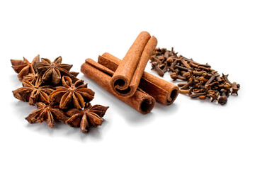 Cinnamon sticks and star anise, cloves isolated on white background close-up. Spices for Christmas mulled wine or grog
