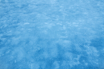 Fototapeta na wymiar Ice blue background. Frozen water, sea. Frosty uneven ice texture in winter.