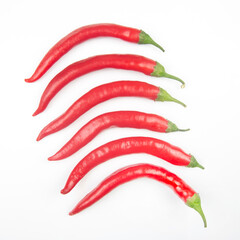 Red hot chili peppers on a white background. food figures. Vitamin vegetable food
