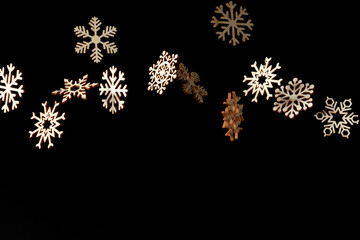 Isolated snowflake cutouts on black