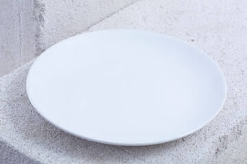 empty plate and fork. On a white background.