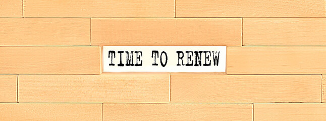 TIME TO RENEW . text on the wooden block wall, business