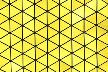 Trendy yellow and black colored abstract futuristic metallic geometric ornaments background. Year color concept.