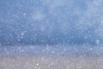 blurred background snowfall nature, abstract falling snowflakes design