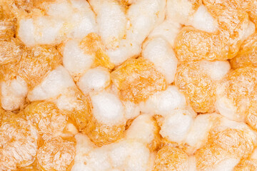 Texture of puffed multi-grain crispbread with pumpkin close-up