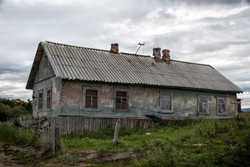 Fototapeta na wymiar Old wooden houses , Arctic, Barents Sea, the village of Teriberka