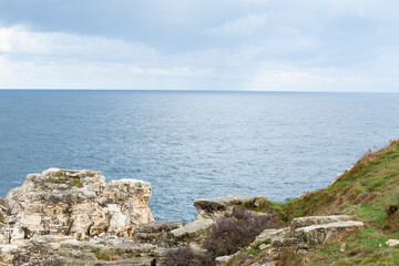 Fototapeta na wymiar sea, clouds and rocks. landscape