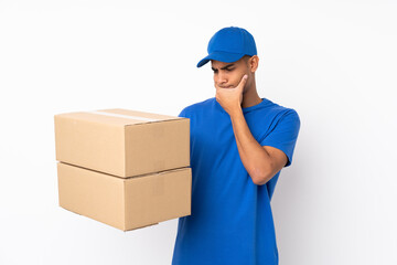 Fototapeta na wymiar Delivery man over isolated white background with sad expression