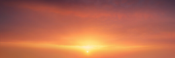 background of cloudscape at the sunset with sunshine on sky and red clouds