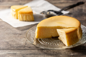 Traditional New York cheesecake on wooden table