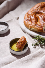 Homemade fresh baked Fougasse (French Bread) with thyme and olive oil on white background. Traditional Provencal dishes. Selective focus