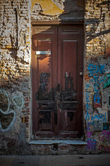 Fototapeta na wymiar Old wooden door on old building