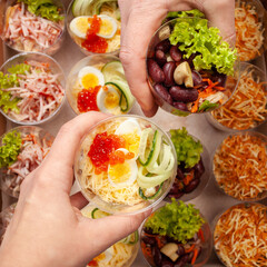 Salads in plastic cups, catering. Home-delivered food. Studio