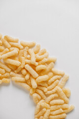 Corn sticks on a white background. Top view. Place for your text