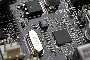 Smd chip ethernet microcontroller on brown motherboard with a lot of surface mount components...