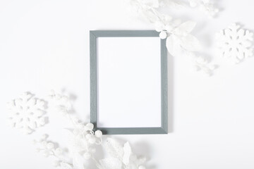 Christmas, winter composition. Xmas decorations, photo frame on white background. Christmas, New Year, winter concept. Flat lay, top view, copy space