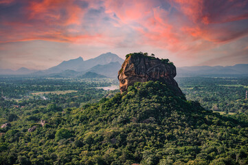 Spectacular view of the Lion rock surrounded by green rich vegetation. Picture taken from Pidurangala Rock in Sigiriya, Sri Lanka.
