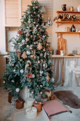 Christmas tree decorations. Blue fir branches with christmas ornaments. Scandinavian christmas tree with eco-friendly decorations. Gifts under the tree.