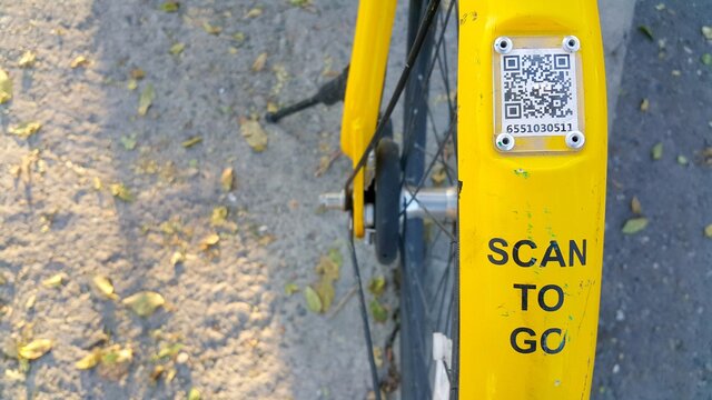 ARMENIA, YEREVAN-OCTOBER 15, 2020. A city Bicycle wheel with an inscription on it, a transition scan, and a QR code icon. The rental of vehicles. - Powered by Adobe