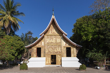 Luang Prabang Laos famous beautiful Buddhist temples set against blue sky