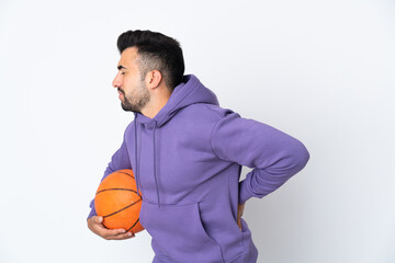Man playing basketball over isolated white wall suffering from backache for having made an effort