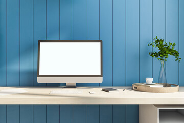 Creative designer table with blank computer screen