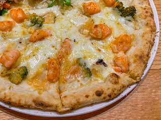 Close up photo of delicious handmade shrimp cheese pizza