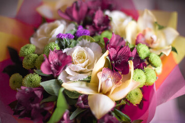 Beautiful bouquet of yellow cabbage roses, pink Alstroemeria, green chrysanthemums.