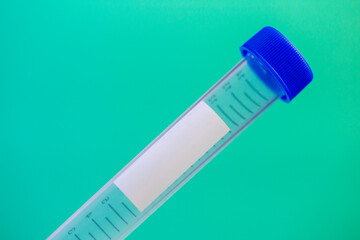 medical test tube with recording tag and blue plastic cover