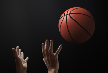 Basketball theme. The moment the ball is thrown. There are only hands and a ball in the frame