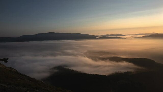 Timelapse shot of Oiz mountain and clouds during sunset, Spain