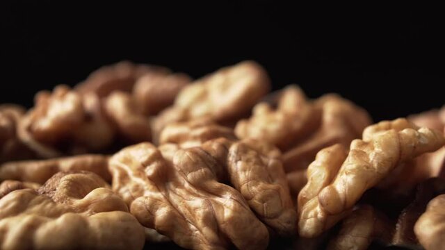 Peeled walnut, close up, dolly shot. Nutrient-rich foods.