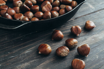 fresh chestnut on dark wooden table
