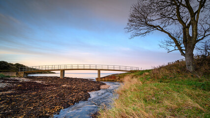 Howick Burn Coastal Path Footbridge, on the shoreline at Howick on the Northumberland coast AONB