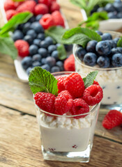 Curd dessert with berries and mint.