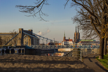A large stone bridge with a road for cars.