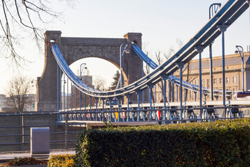 A large stone bridge with a road for cars.