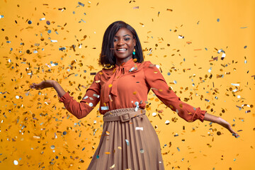 Celebrating happiness, young woman dancing with big smile throwing confetti. Party, holidays and...