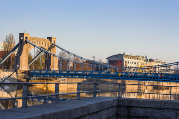 A large stone bridge with a road for cars.