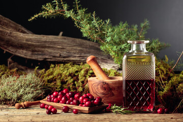 Cranberries and decanter with cranberry juice.