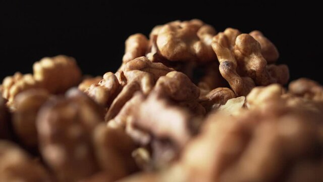 Peeled walnut, close up, rotate. Nutrient-rich foods.