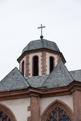 Church tower with cross and empty sky