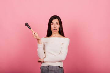 Cosmetologist beautician holding a tool in her hands, permanent makeup master, permanent makeup