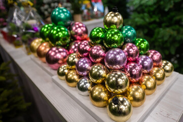 Christmas balls on the stand. Close-up of Christmas toys in a store