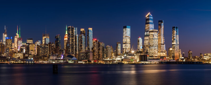 Manhattan West skyline at sunset with Hudson Yards skyscrapers. Cityscape from across Hudson River, New York City, NY, USA